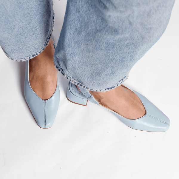 minimalist slingback block heeled pump in sky baby blue leather top down on the foot