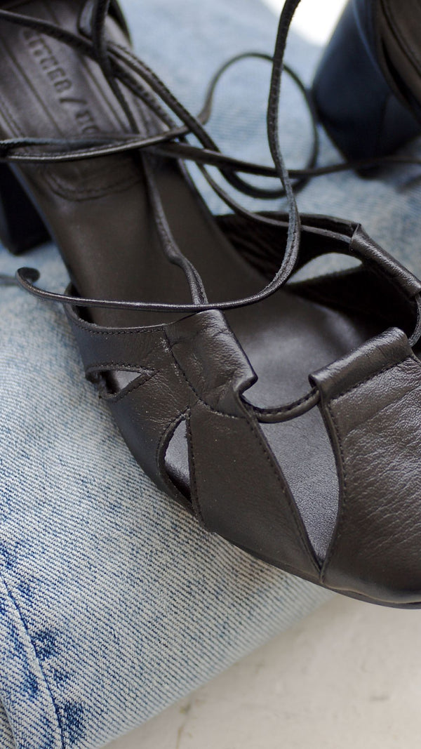 demi lace up heel in black leather detail view