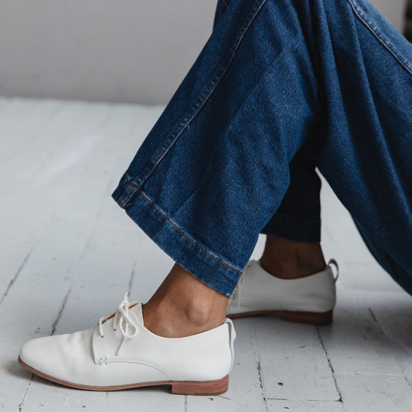 white leather oxford lace up derby glove flat ballerina on the foot