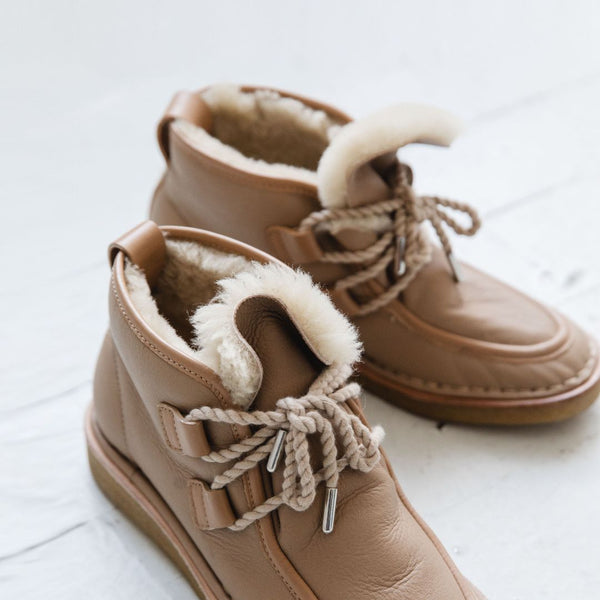 tan nude natural leather lace up shearling moccasin boot crepe sole premium ugg apres ski boot