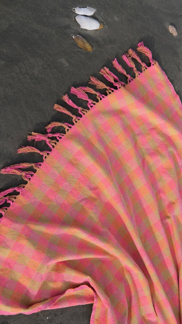 pink and green patterned picnic blanket handwoven in mexico by xyz coop