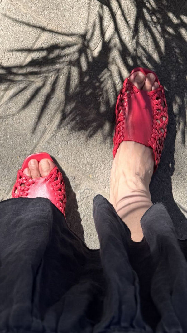 rattan sandal woven basketweave slide sandal in red leather on the foot top view