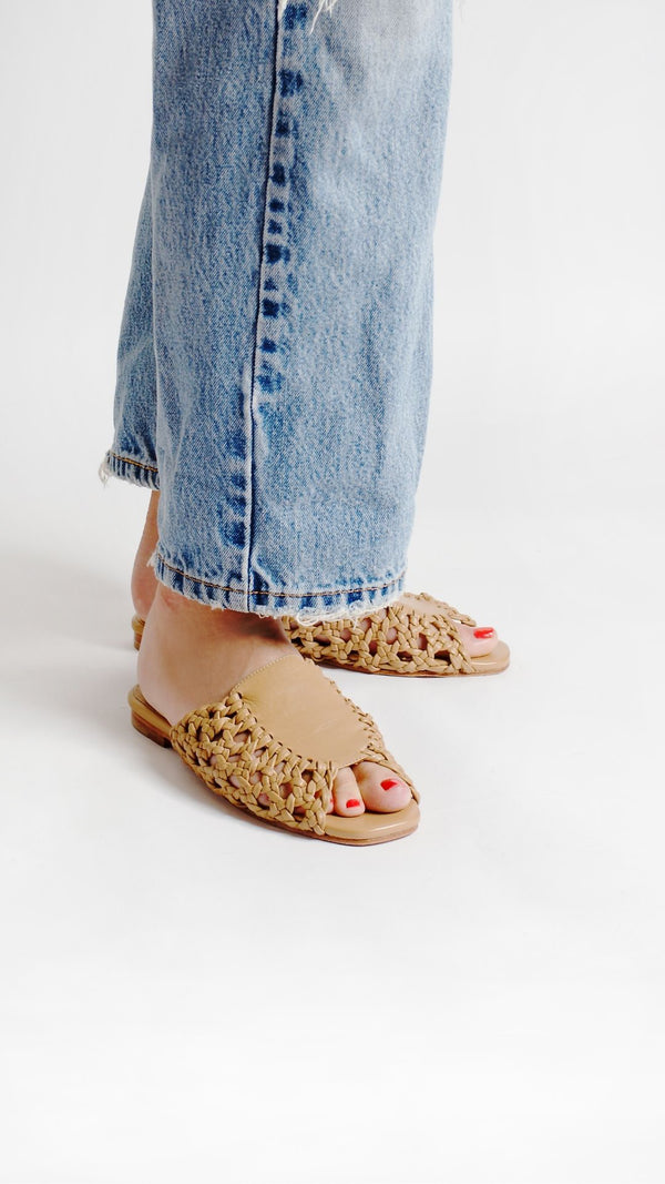 rattan sandal woven basketweave slide sandal in natural tan leather on the foot