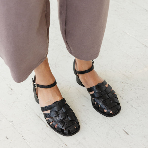fisher low block heel leather ankle strap sandal black tumbled leather top down on foot