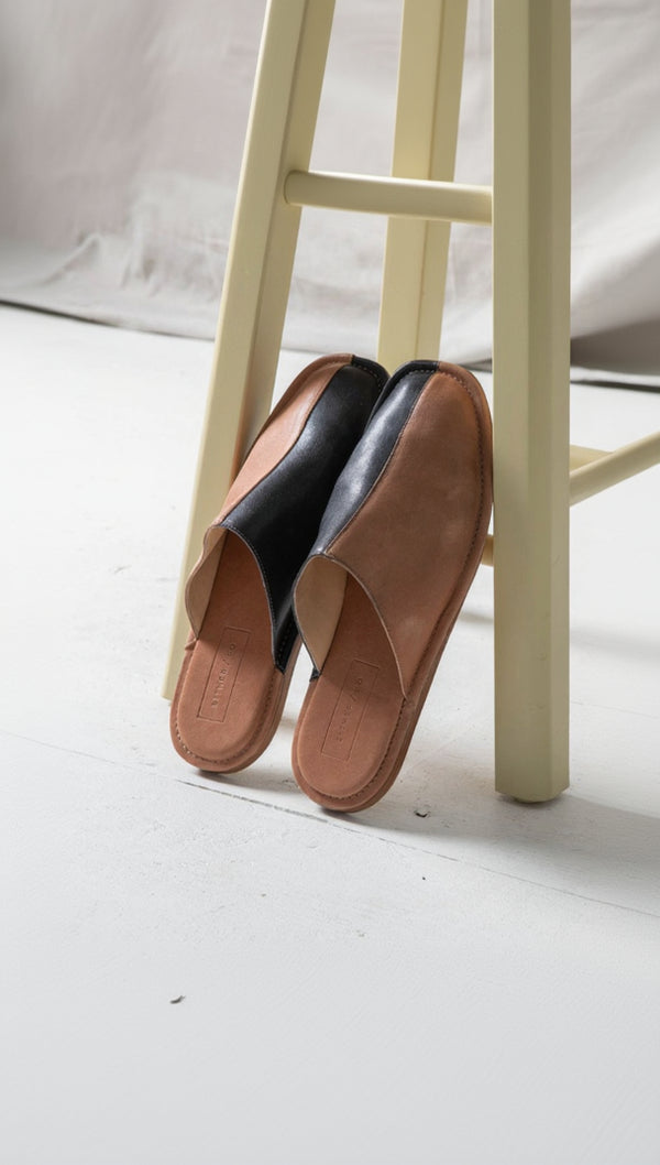 Our newest, comfiest wear-everywhere silhouette. Inspired by the classic menswear slipper, babouche, or uwabaki (Japanese house slipper), this versatile style is equally suited for a lazy day around the house, running errands, or an art show. Ethically Handmade in Portugal. Either.Or - Handmade with Care.