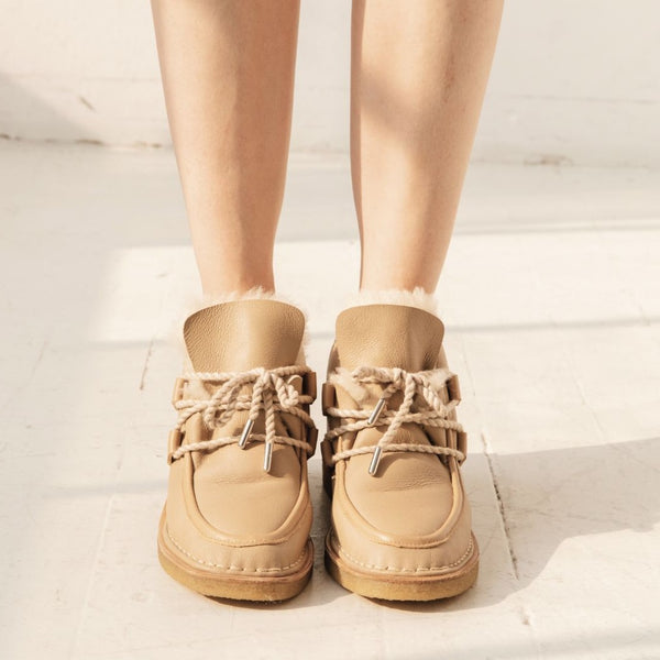 tan nude natural leather lace up shearling moccasin boot crepe sole premium side on the foot close up