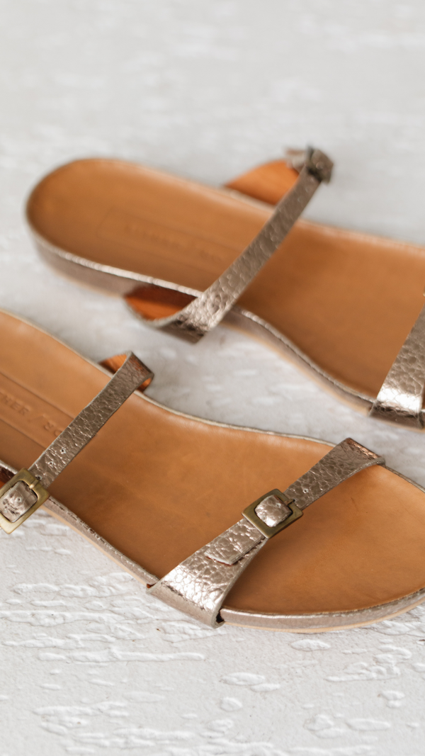 Metallic cork footbed sandal minimalist two buckle strap slide close up