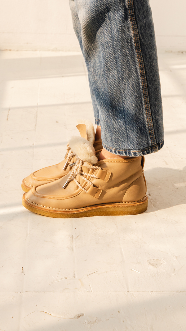 tan nude natural leather lace up shearling moccasin boot crepe sole premium side view on the foot