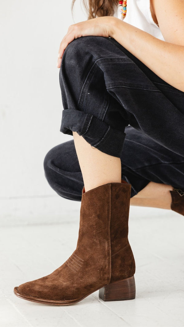 west boot brown chocolate suede block heel western square toe mid boot on foot side