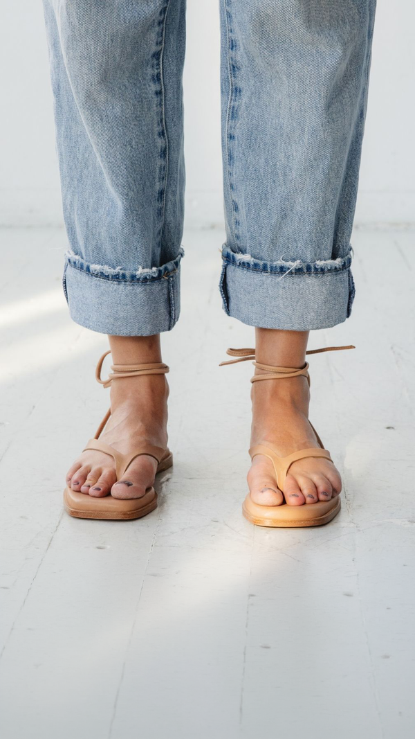 isla minimal leather thong flop flop sandal padded tan nude front on the foot