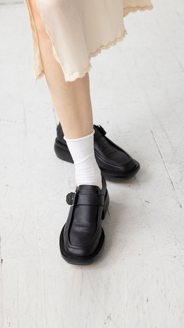 monk strap buckle platform chunky loafer in black full grain leather on the foot