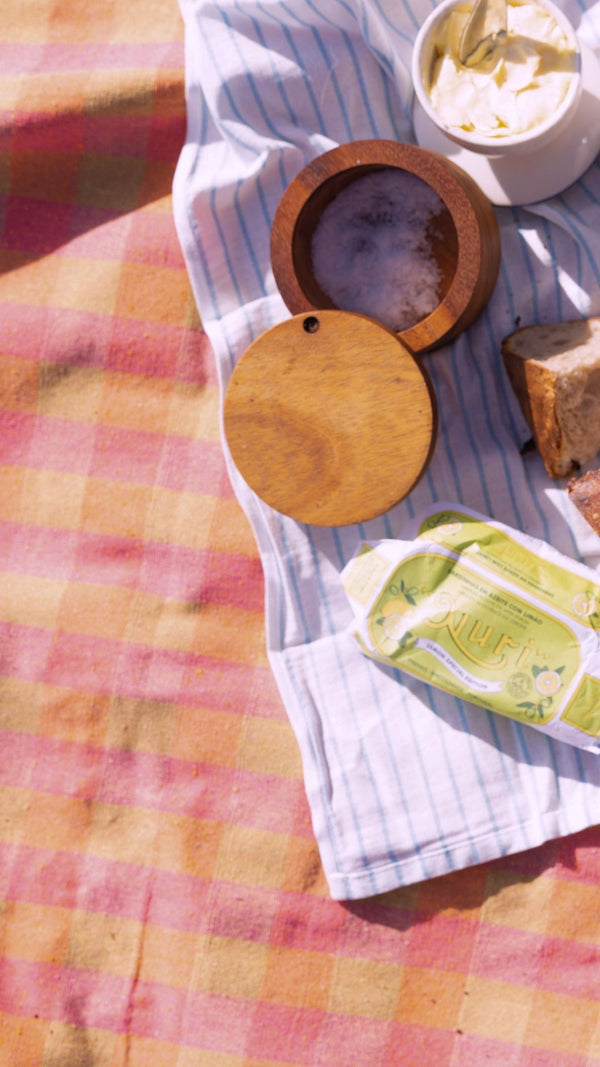 picnic spread close up of xyz coop picnic blanket pink and green