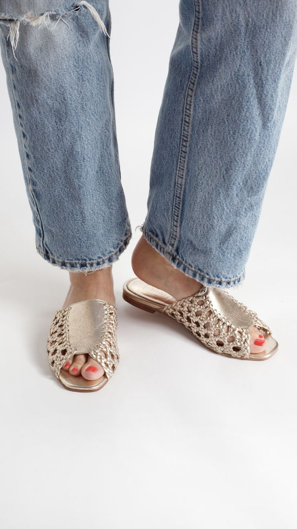 rattan sandal woven basketweave slide sandal in gold metallic on the foot