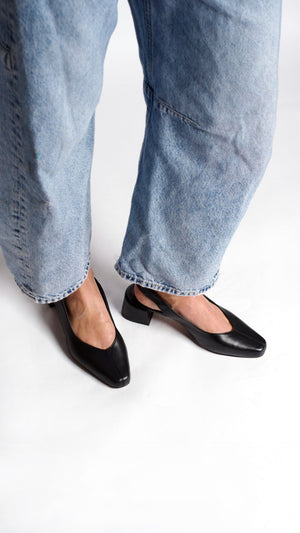 minimalist slingback block heeled pump in black italian leather on the foot