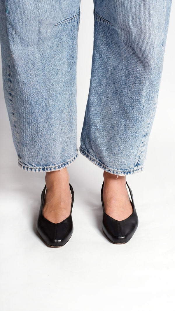 minimalist slingback block heeled pump in black italian leather on the foot front view