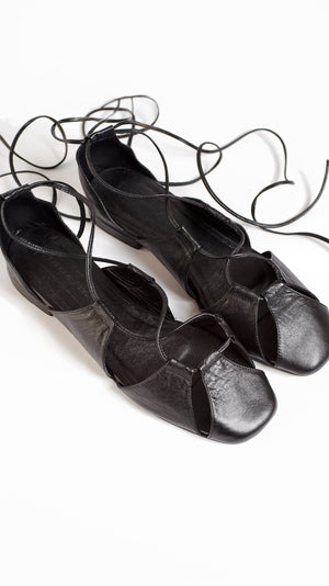 ghillie lace up black leather lace up cage flats sandals top down view